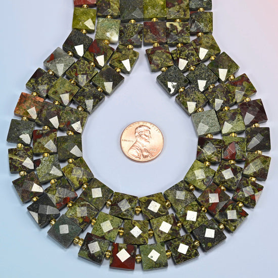 Natural dragon blood stone faceted flat square strands formed into a teardrop loop around a US penny for scale