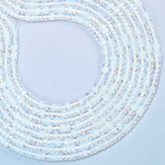 Opalite faceted heishi disc beads curved into an open loop, milky white beads with a soft blue glow