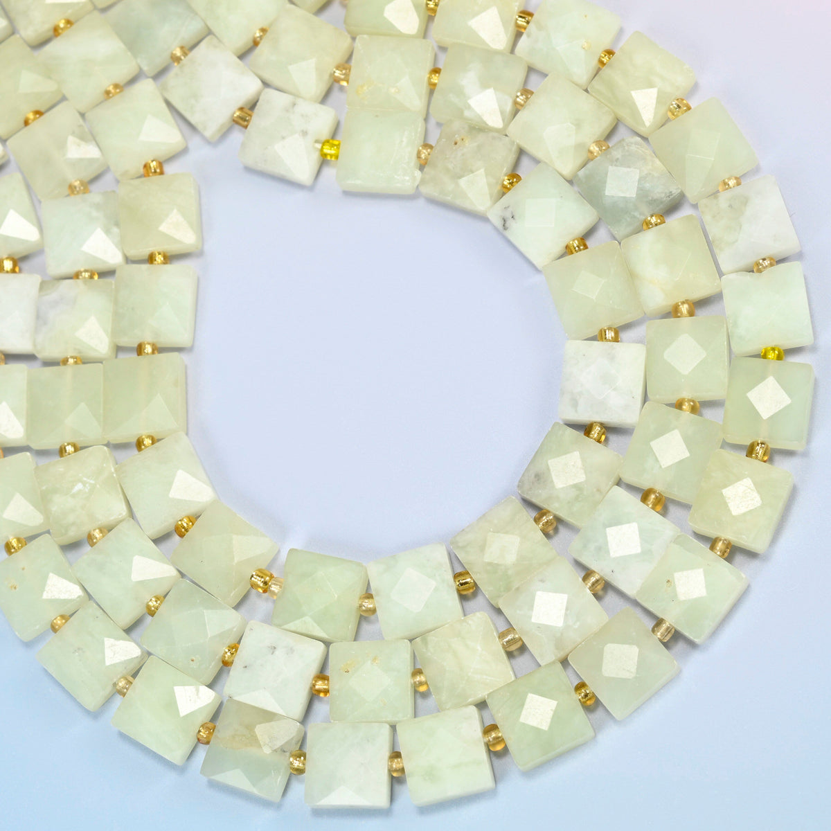New Jade faceted flat square beads curved into an open loop, light yellow-green and cream beads