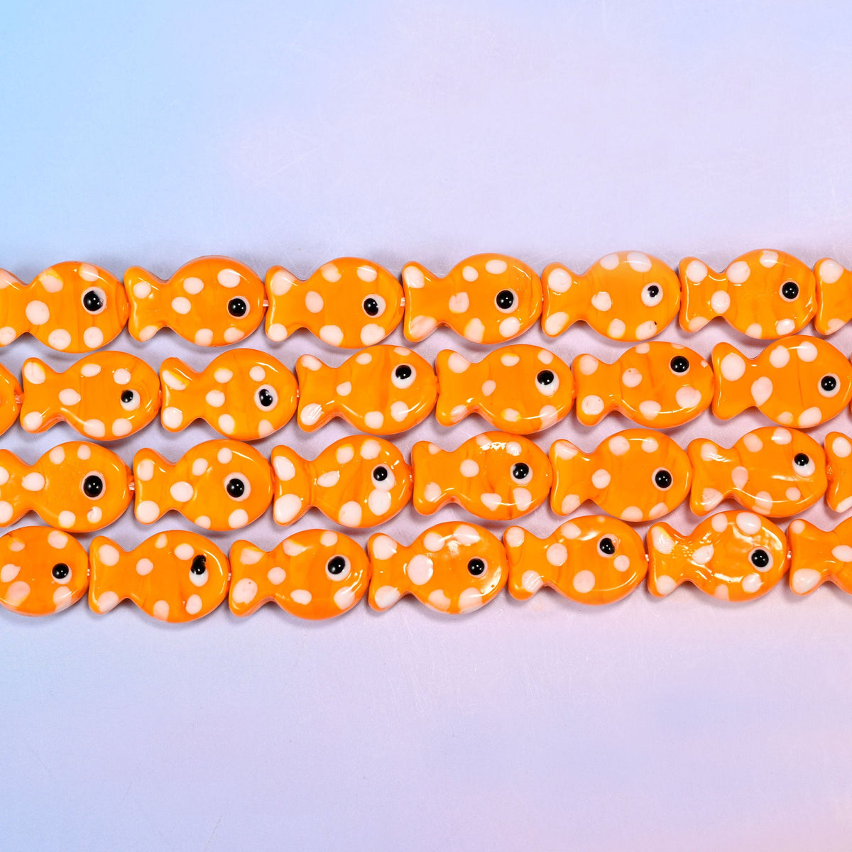 Fish glass beads in warm tangerine orange with white dots