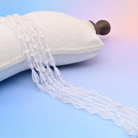 Natural Clear Quartz faceted teardrop beads, icy near-colourless with a lightly frosted surface