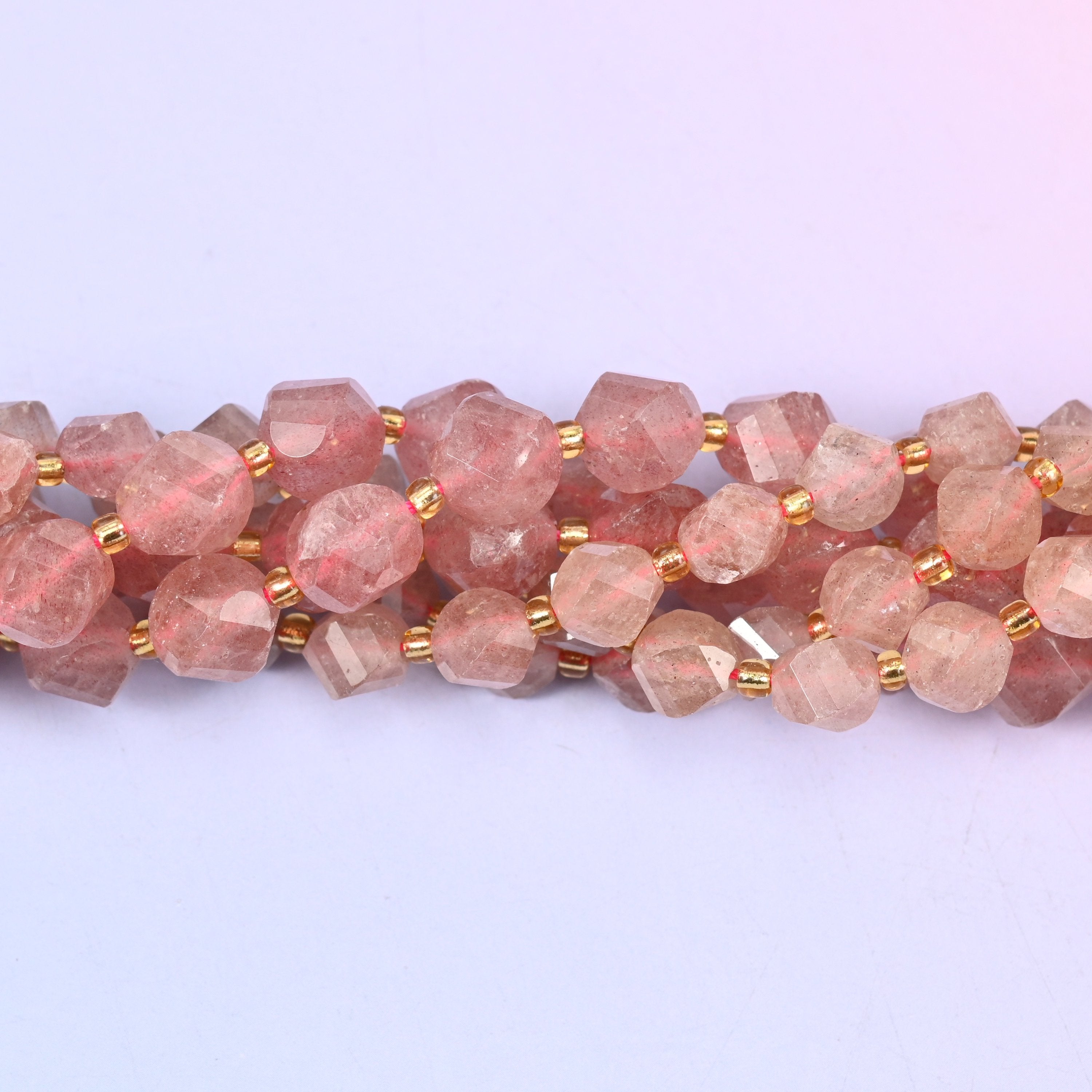 Strawberry Quartz Faceted Spiral Twist Beads, dusty rose quartz flecked with fine silvery-red inclusions