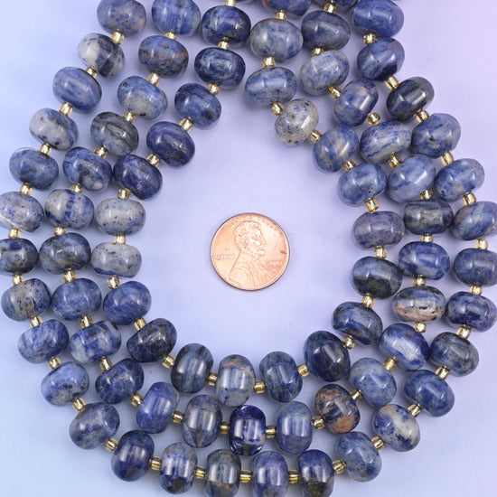 Sodalite smooth pumpkin beads in deep indigo-blue with natural white and gray veining