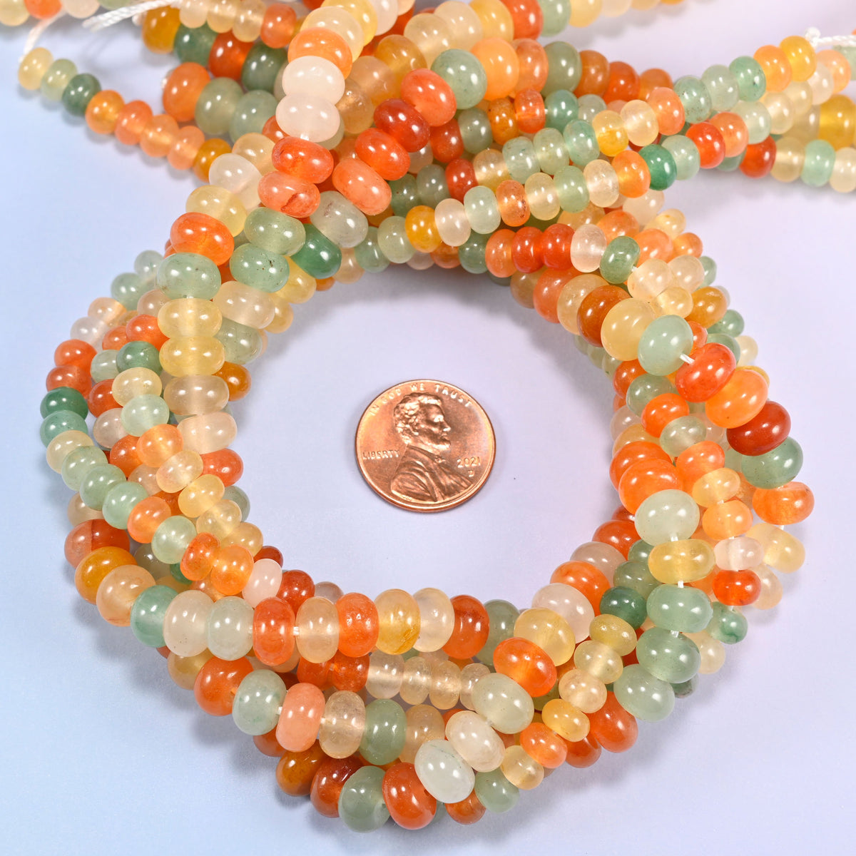 Gold Silk Jade gemstone rondelle beads coiled flat, smooth 4x6mm and 5x8mm discs on a 15.5 inch strand