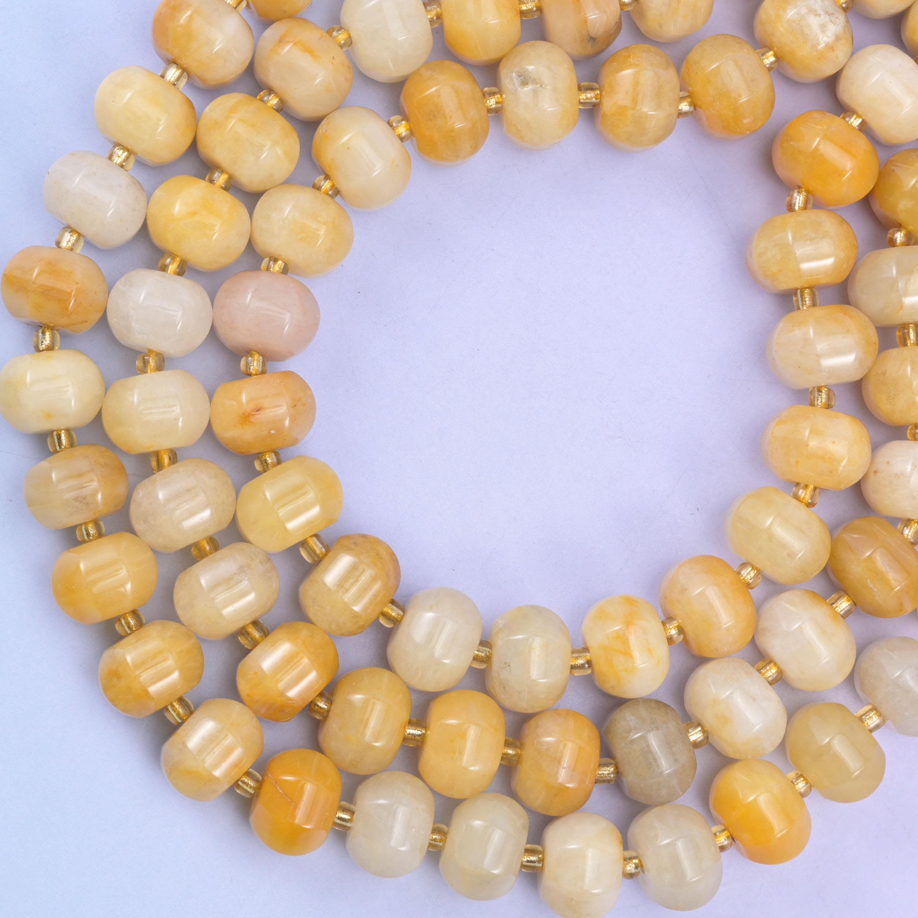 Yellow jade pumpkin beads, approximately 35 beads per strand