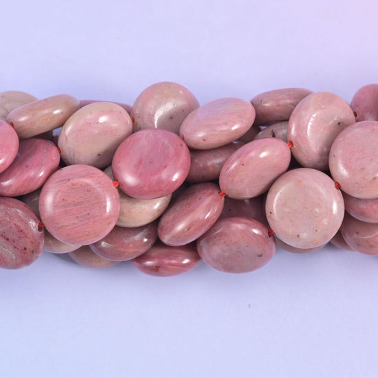 Coin cut Pink Rhodonite beads with a smooth polished finish