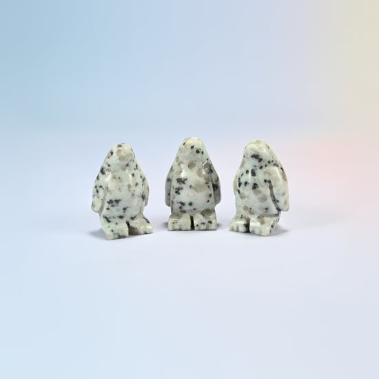 Three kiwi jasper penguin crystal carvings, 1.5 inch, cream natural stone with dark spots