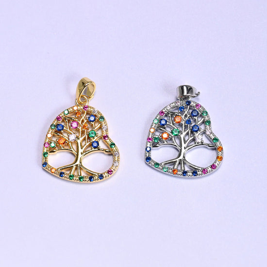 Heart tree of life zirconia charm colour comparison: a gold openwork heart pendant beside the same design in silver tone.