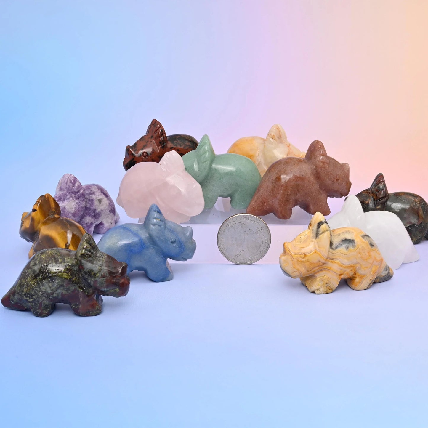 Triceratops dinosaur crystal carvings hand-shaped from polished gemstone