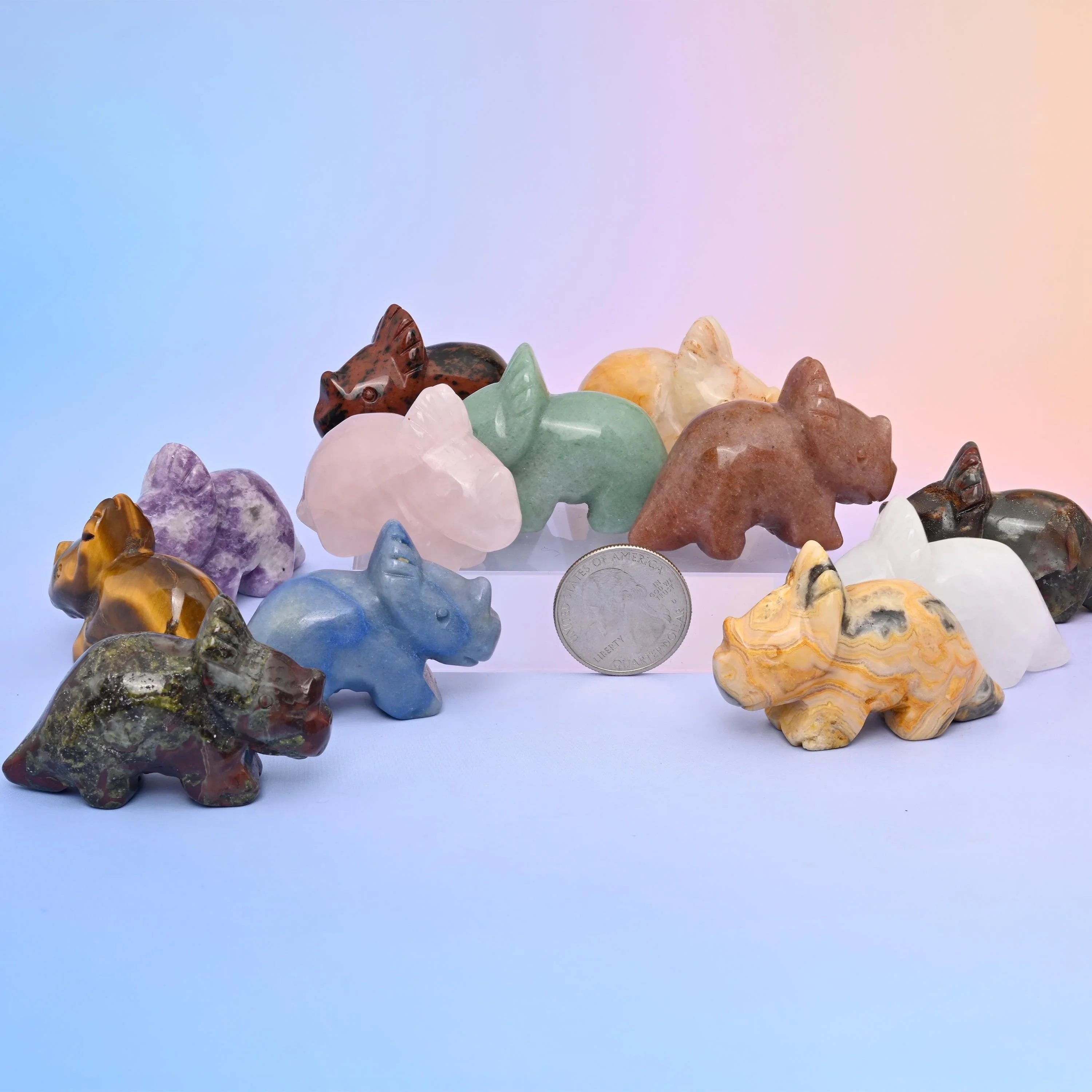 Triceratops dinosaur crystal carvings hand-shaped from polished gemstone