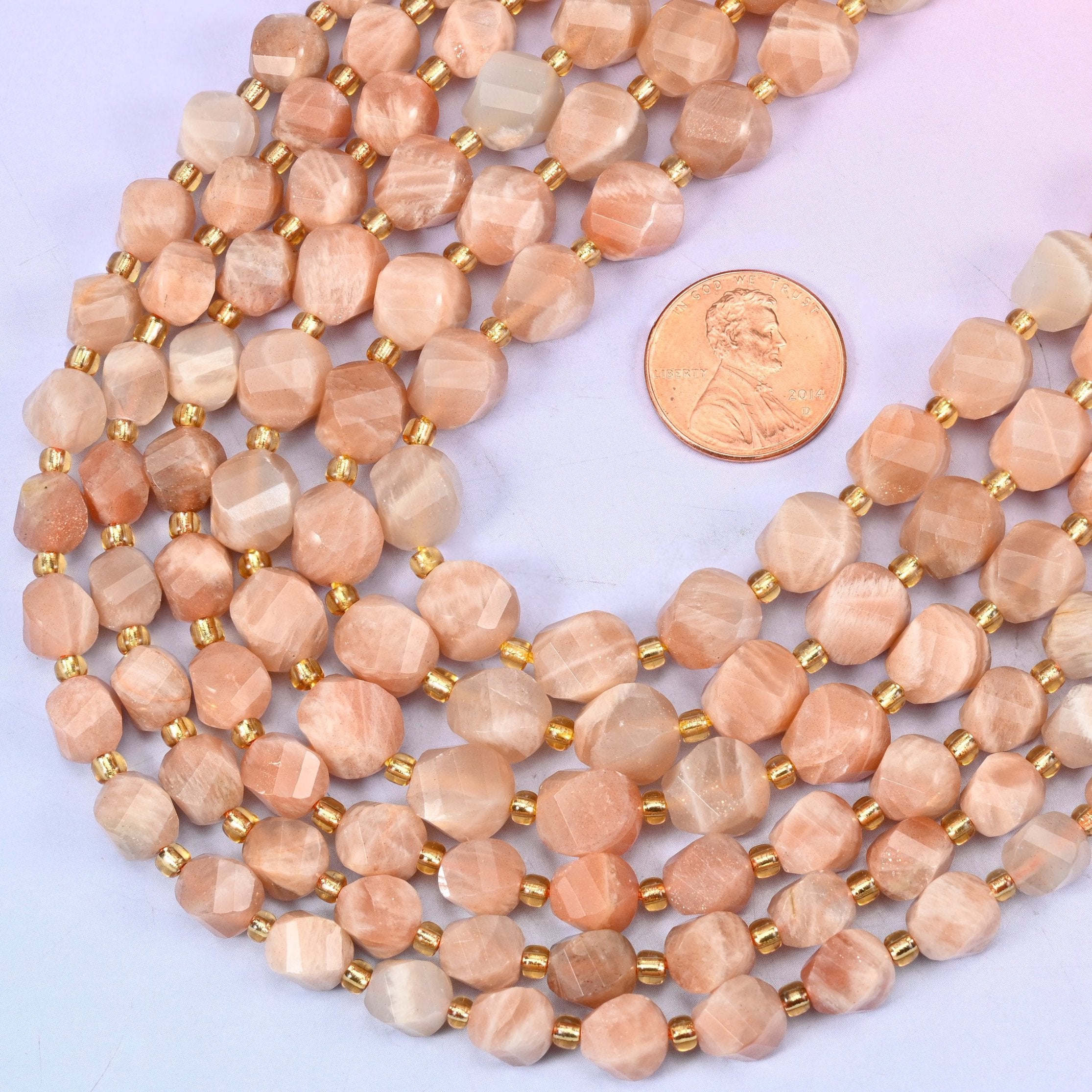 Faceted spiral twist cut Orange Sunstone beads
