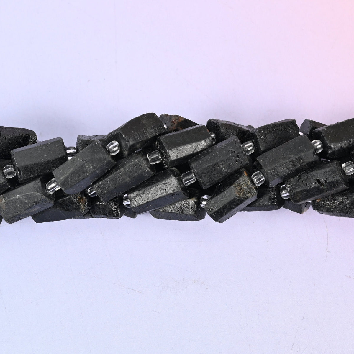 Raw Black Tourmaline Faceted Tube Beads, approximately 27 beads