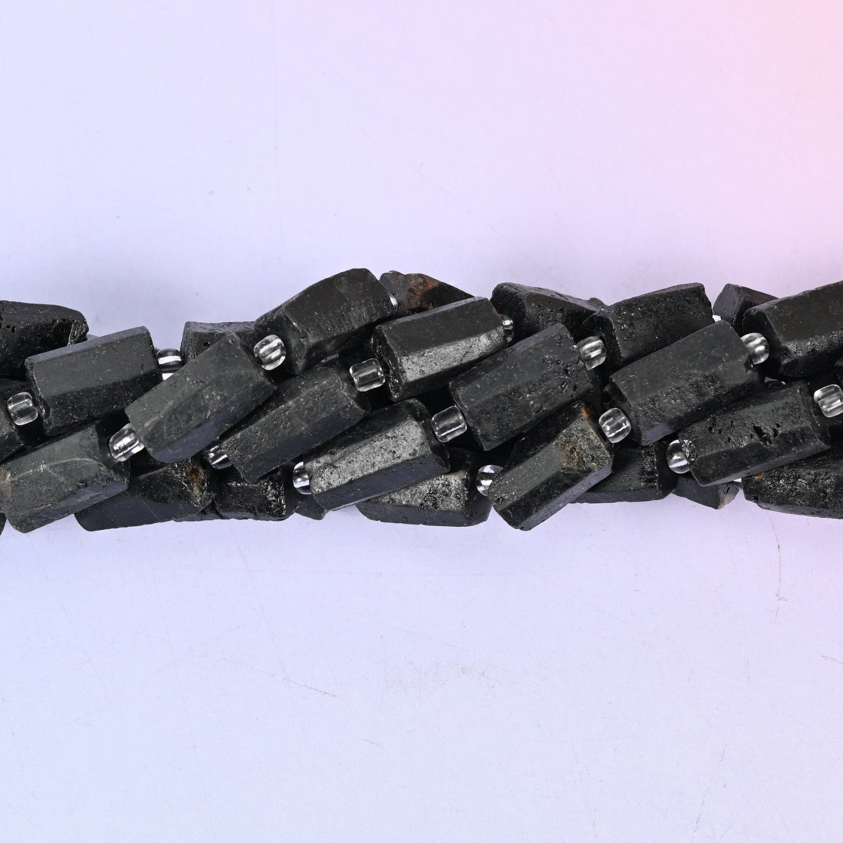 Raw Black Tourmaline Faceted Tube Beads, approximately 27 beads