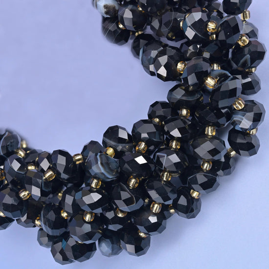 Faceted rondelle cut black stripe agate beads