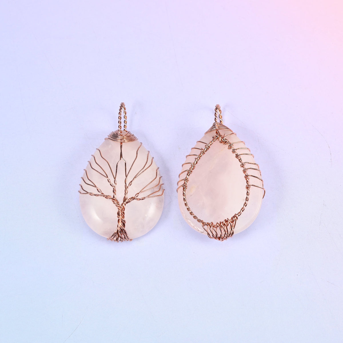 Teardrop Crystal Pendant with Copper Wired Tree in rose quartz, front and back pair with the copper wrapping visible along the edges of the stone.