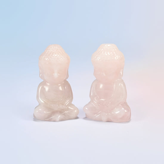 Two natural rose quartz sitting Buddha carvings in light pink, 2 inch