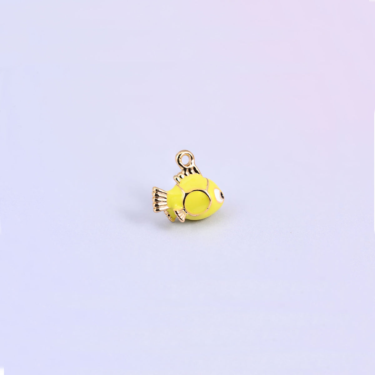 A single fish charm in yellow green enamel, gold plated dorsal fin and a small ring at the top.
