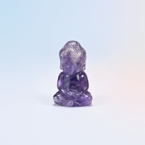 Natural amethyst sitting Buddha carving in purple with white veins, 2 inch