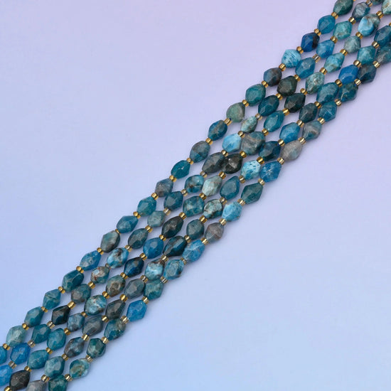 Blue Apatite rice barrel beads, approximately 39 beads per strand