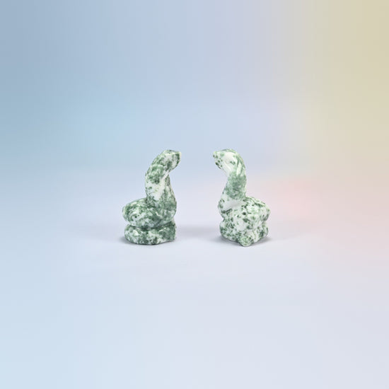 Cobra snake crystal carving in tree agate, white natural stone with green dendrite patterns