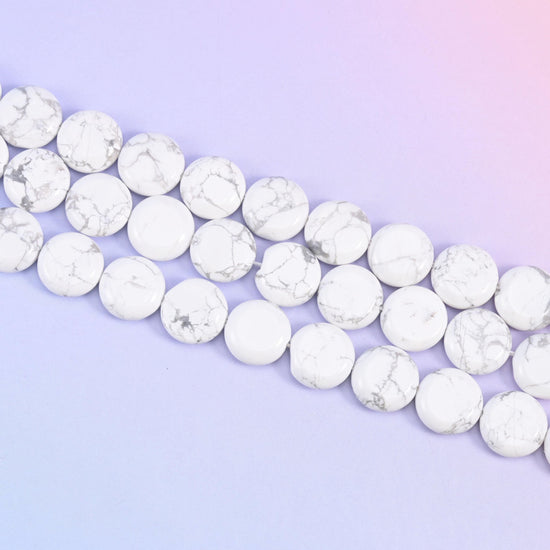 White Howlite coin beads with grey vein patterning across a white base