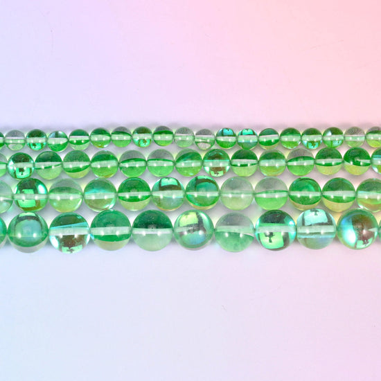 Mystic Aura beads in apple-green iridescent glass with aqua and gold flashes