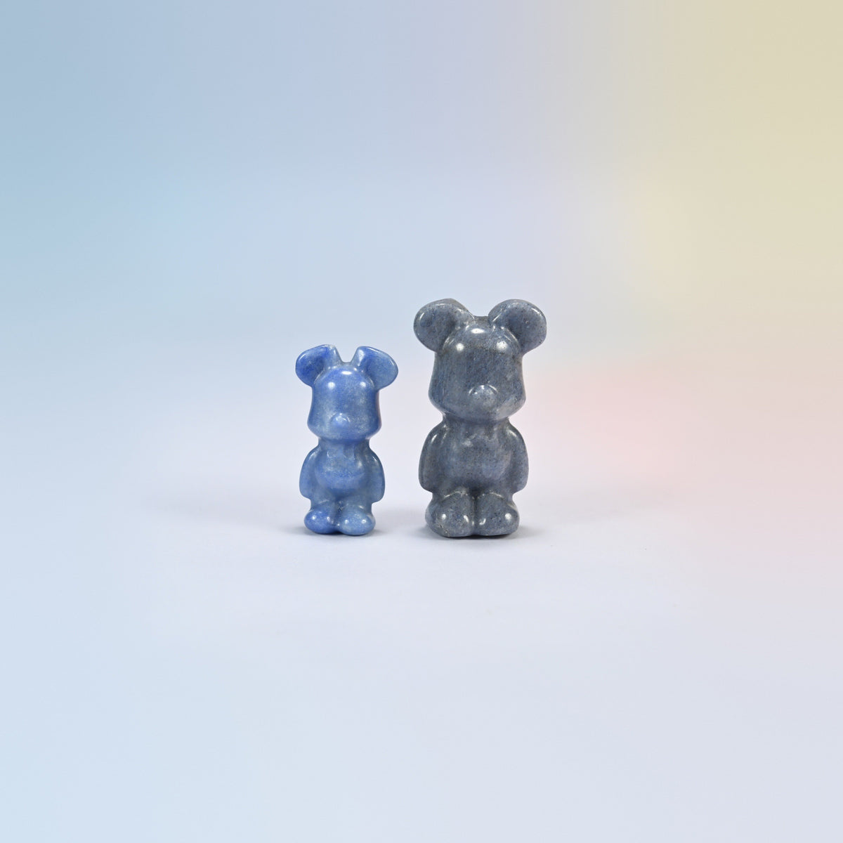 A 1.5 inch and a 2 inch blue aventurine power bear crystal carving, deep blue natural stone with a soft shimmer