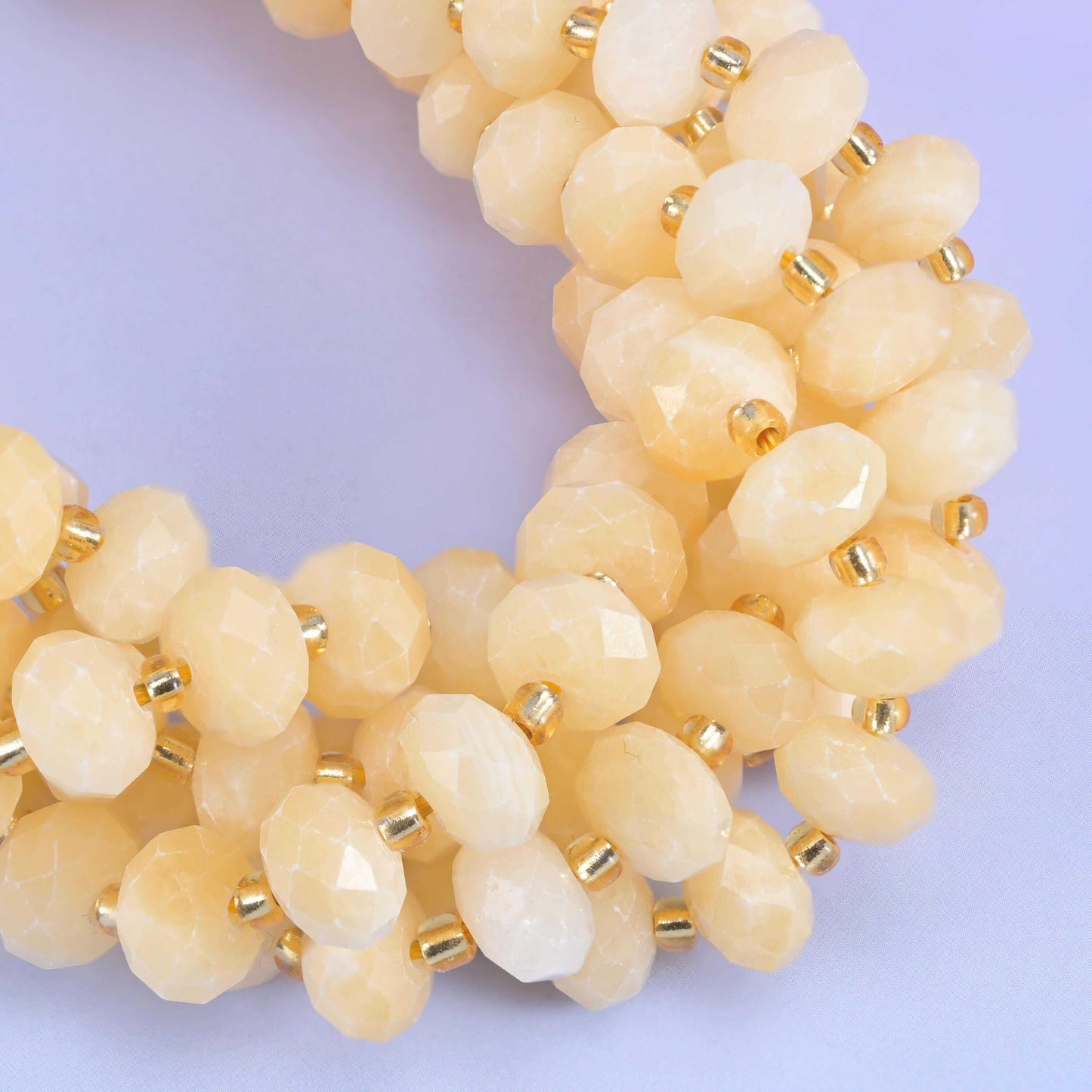 Faceted rondelle cut beige jade beads