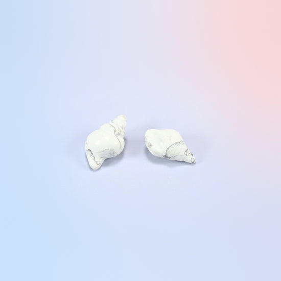 Two natural white howlite conch shell crystal carvings, 1.5 inch, white with gray veining