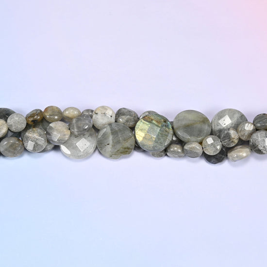 Gray Labradorite faceted coin beads in a single close run, faceting worked across the front of each disc