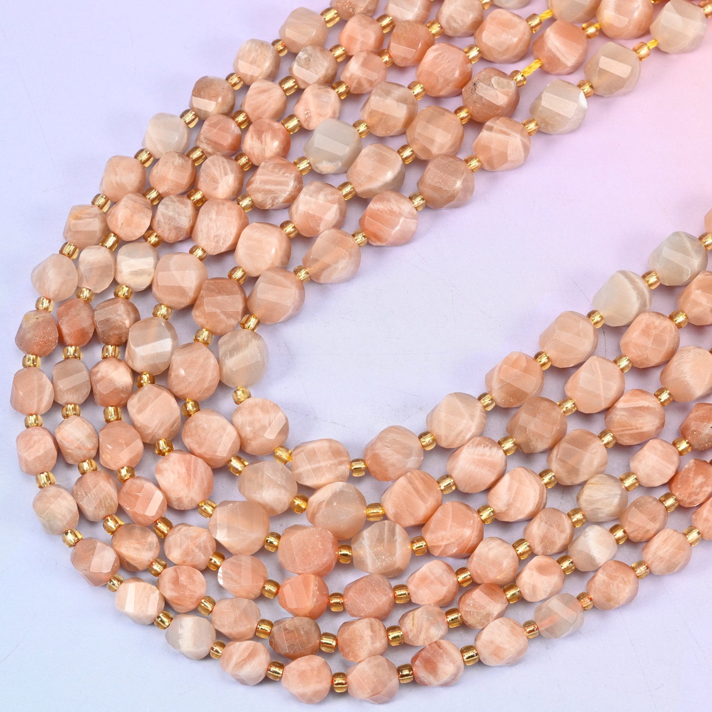 Orange Sunstone faceted spiral twist beads, 15 inch strand