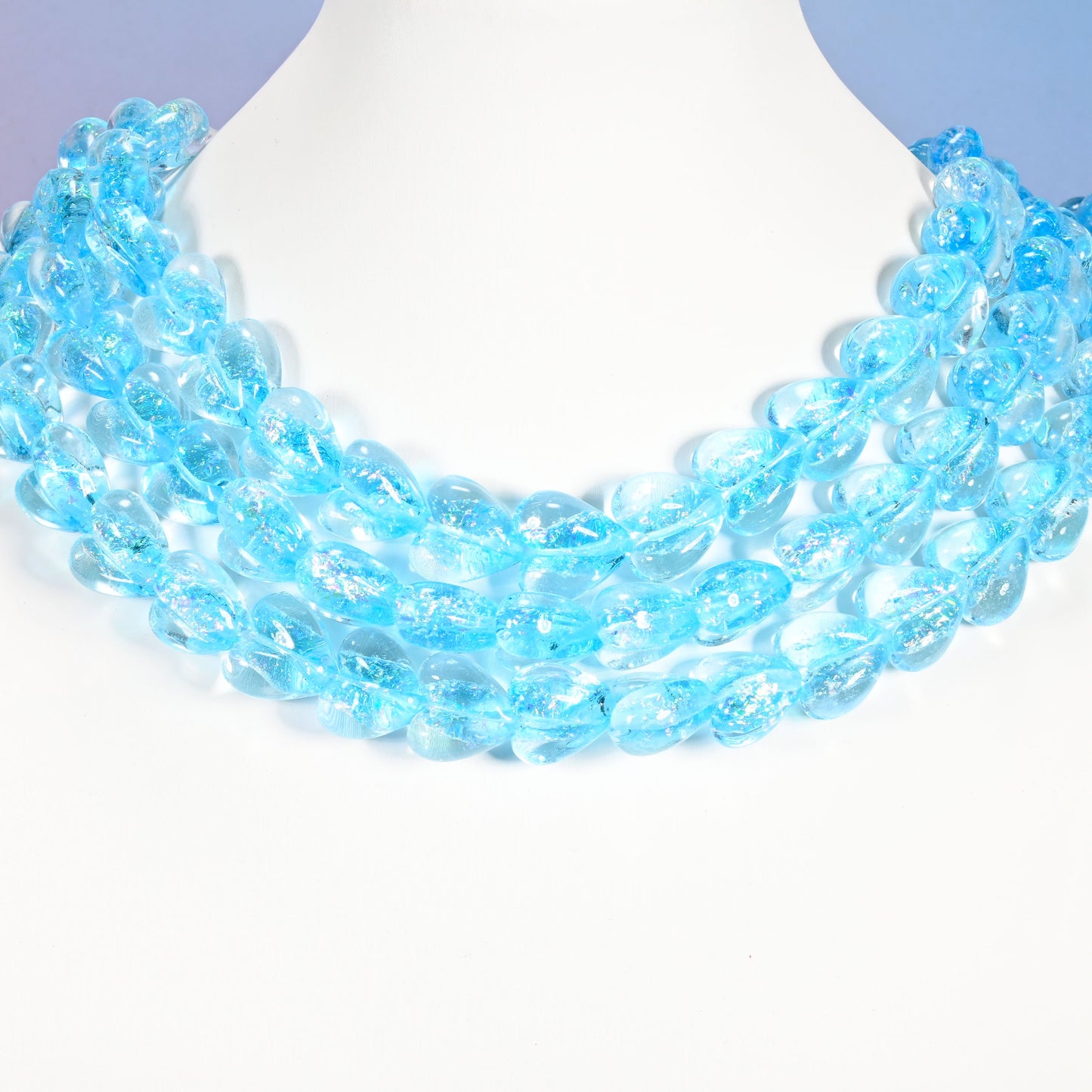 Iridescent light blue heart glass beads in draped strands, 24 heart beads on an 11.5 inch strand