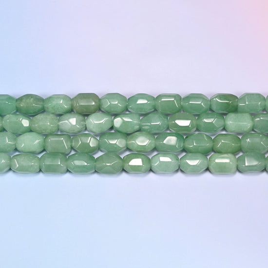 Natural Green Aventurine Faceted Barrel Beads in soft sage through medium jade green.