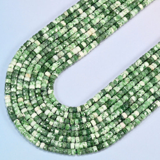 Tree agate faceted heishi disc beads in several strands curved into a wide U, green and white spotted stone