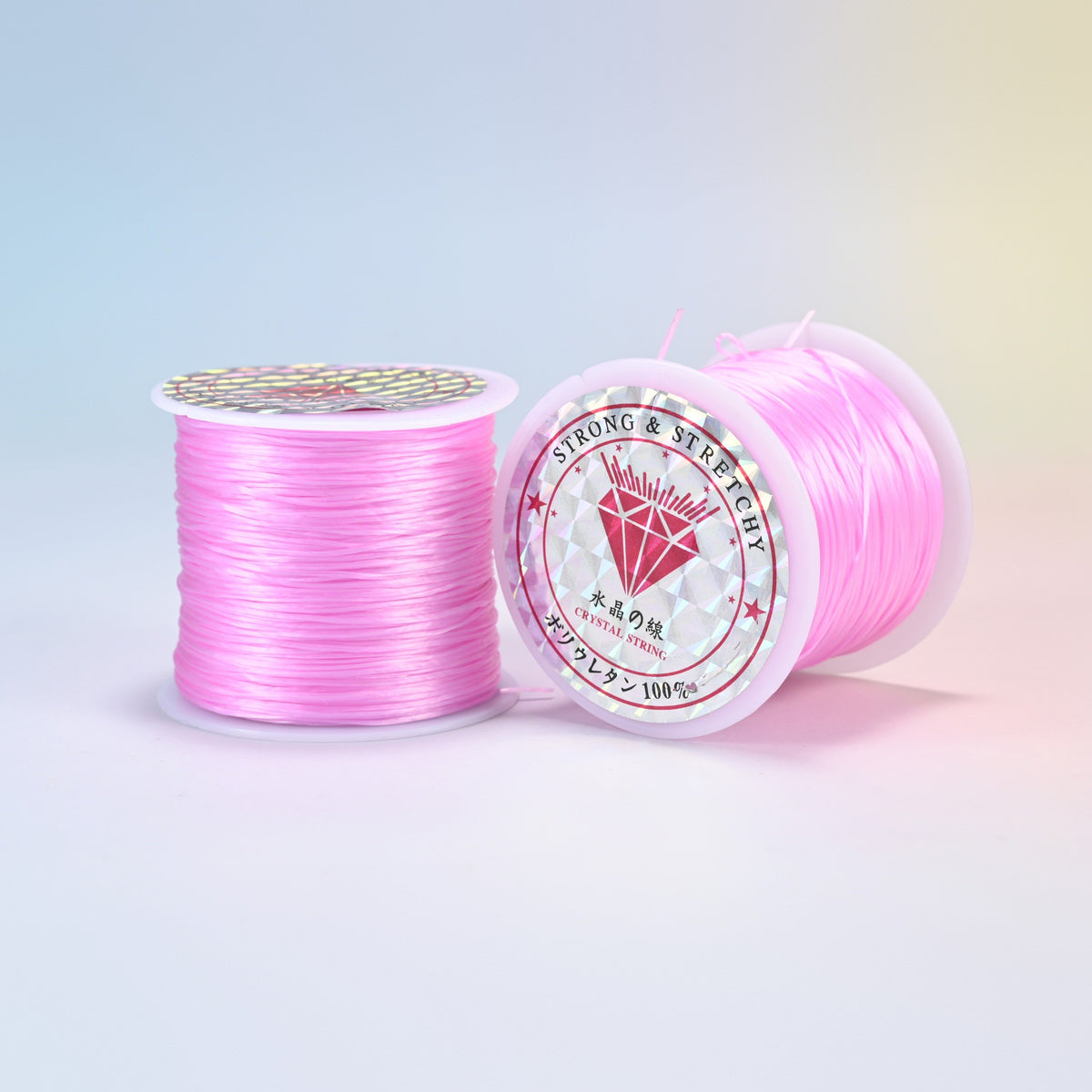 Two rolls of pink 0.7-0.8mm elastic stretch string, glossy polyurethane bead cord with a holographic label