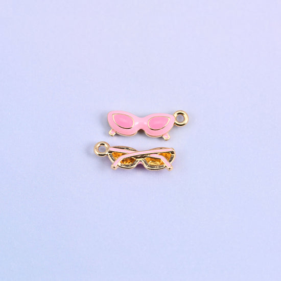 Pink cat eye sunglasses charm with light pink lenses, front and back.
