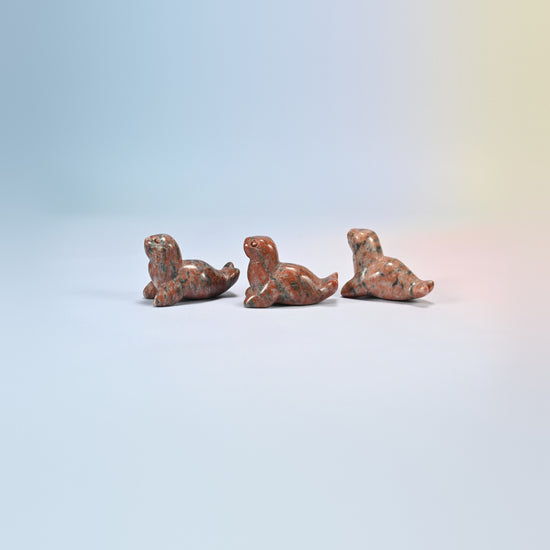 Three sesame jasper sea lion crystal carvings, 1.5 inch, salmon pink natural stone with dark spots