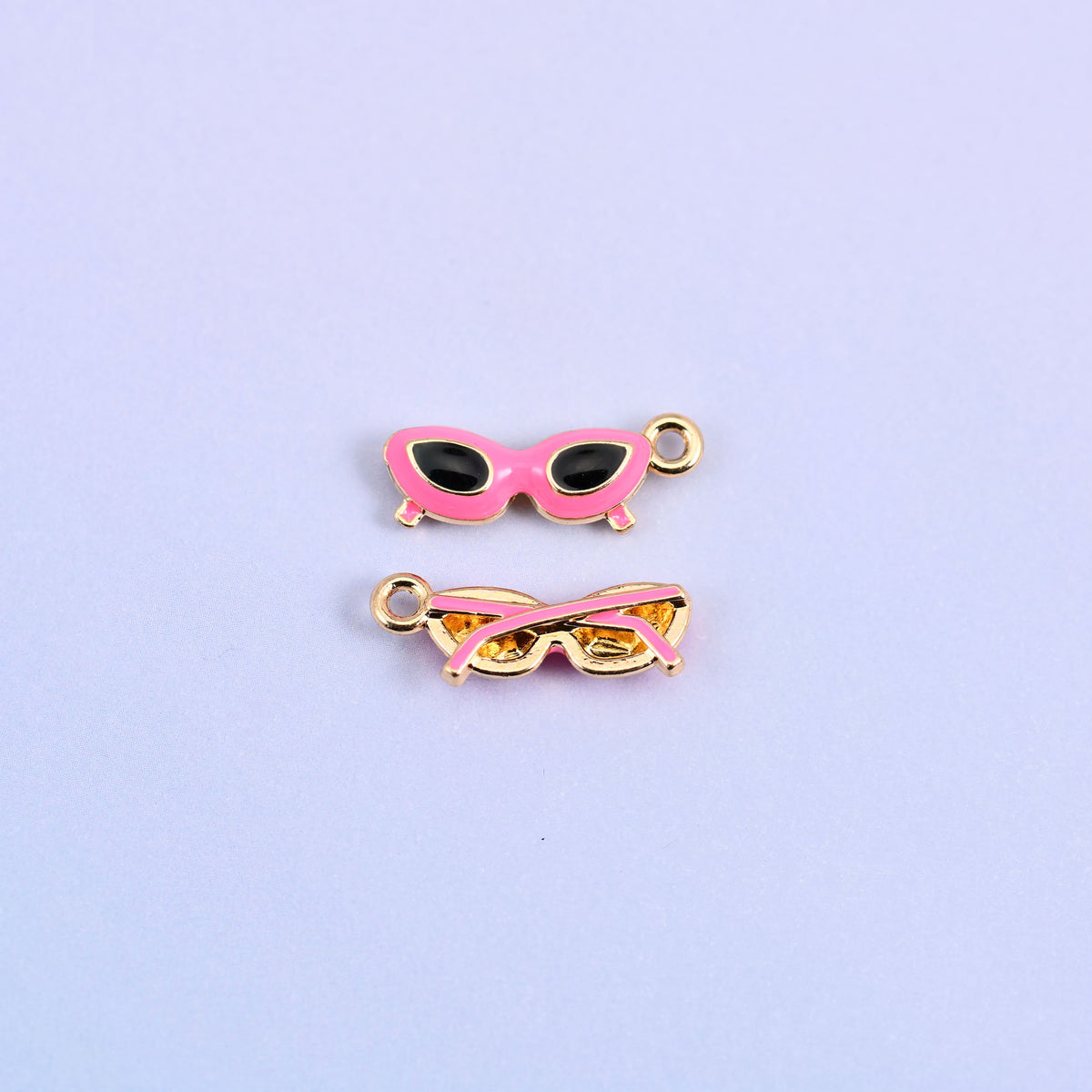 Pink cat eye sunglasses charm with black lenses, front and back.
