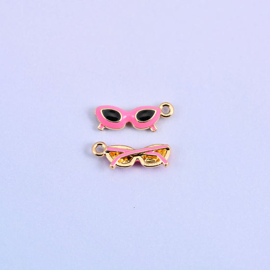 Pink cat eye sunglasses charm with black lenses, front and back.