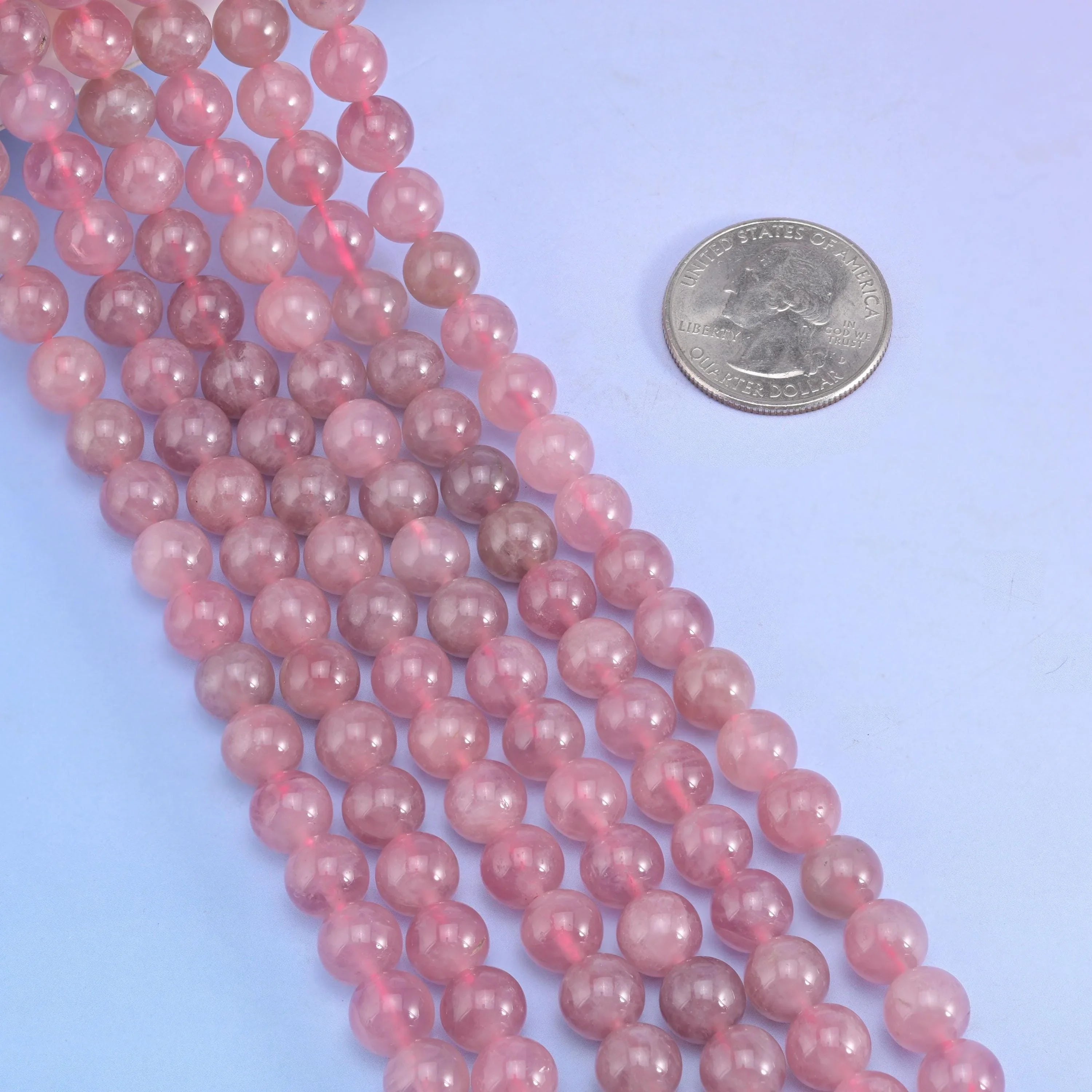 Smooth round cut Madagascar Purple Rose Quartz beads.