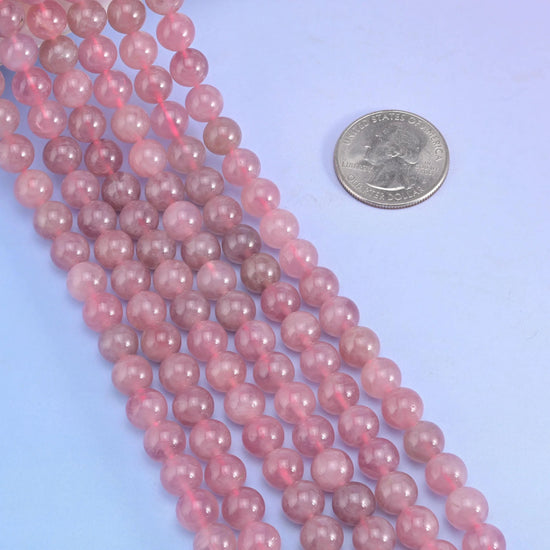 Smooth round cut Madagascar Purple Rose Quartz beads.
