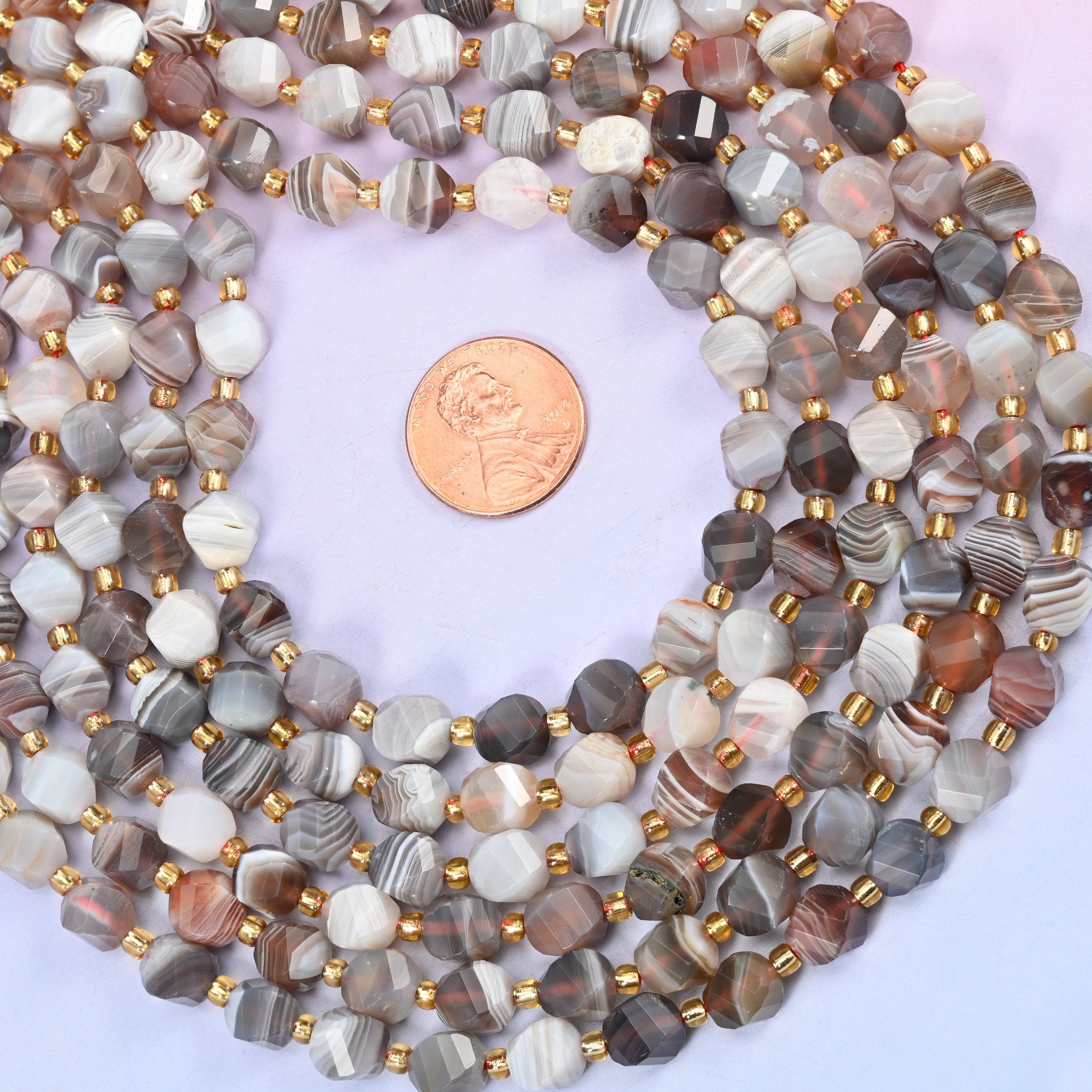 Botswana agate natural stone beads, 8mm, polished to a smooth finish with the banding visible through the surface