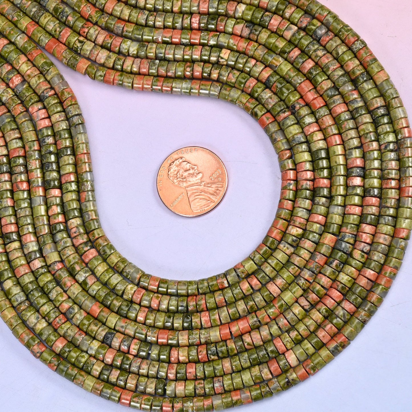 Natural Unakite smooth heishi disc beads in a blend of moss green and salmon pink