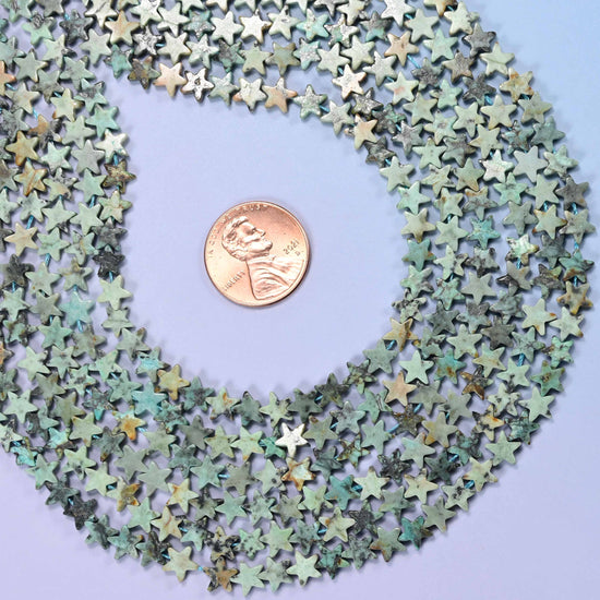 African Howlite Flat Star Beads 6mm, approximately 75 beads per strand