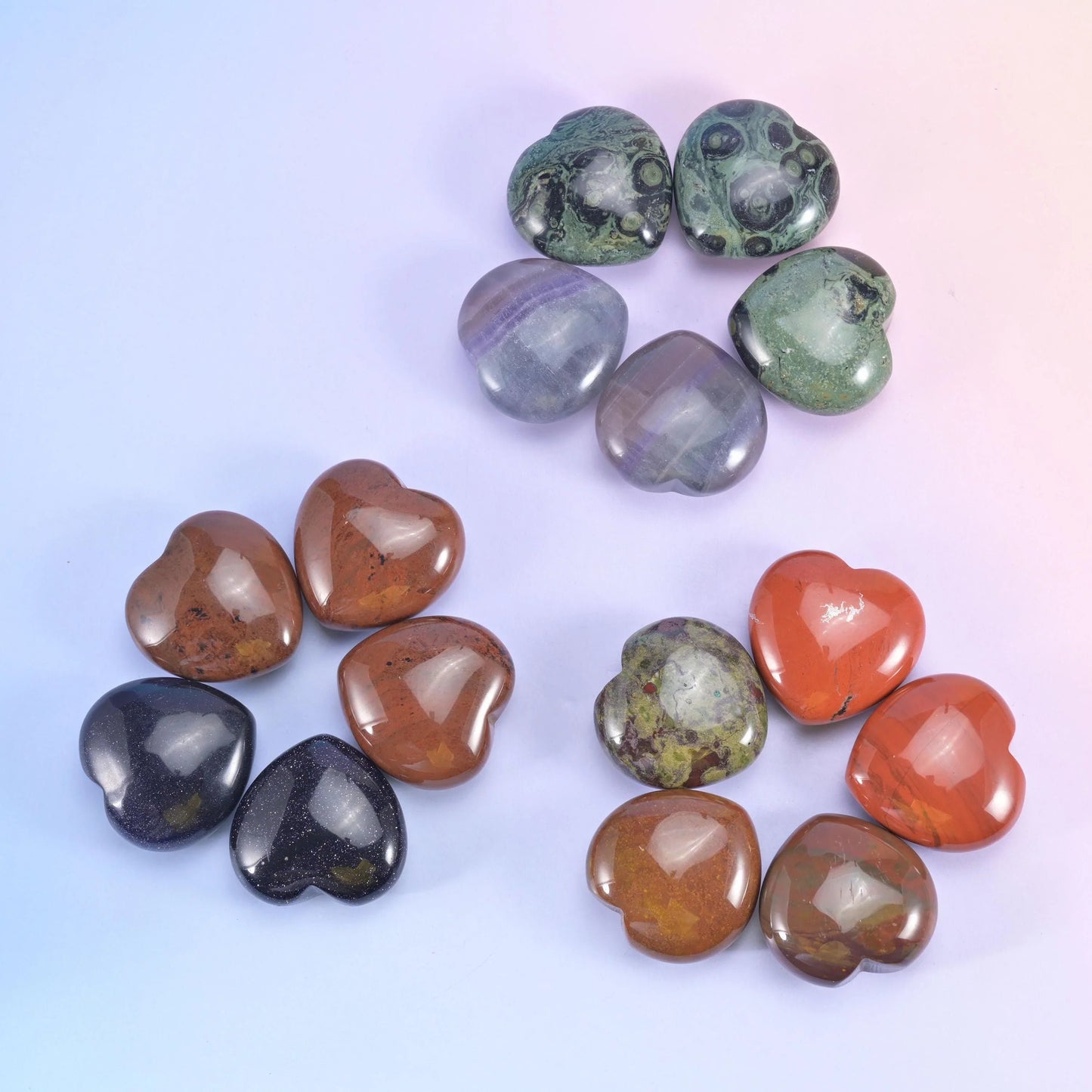 Loose arrangement on lilac, rust red, dark obsidian, olive and warm brown hearts side by side