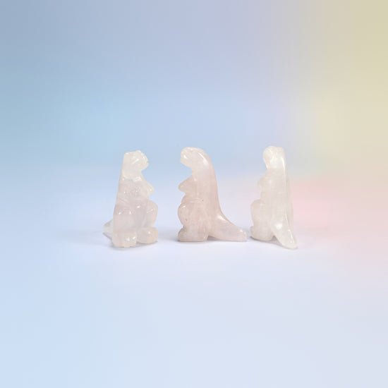 Three rose quartz T-Rex dinosaur crystal carvings, 2 inch, light pink natural stone