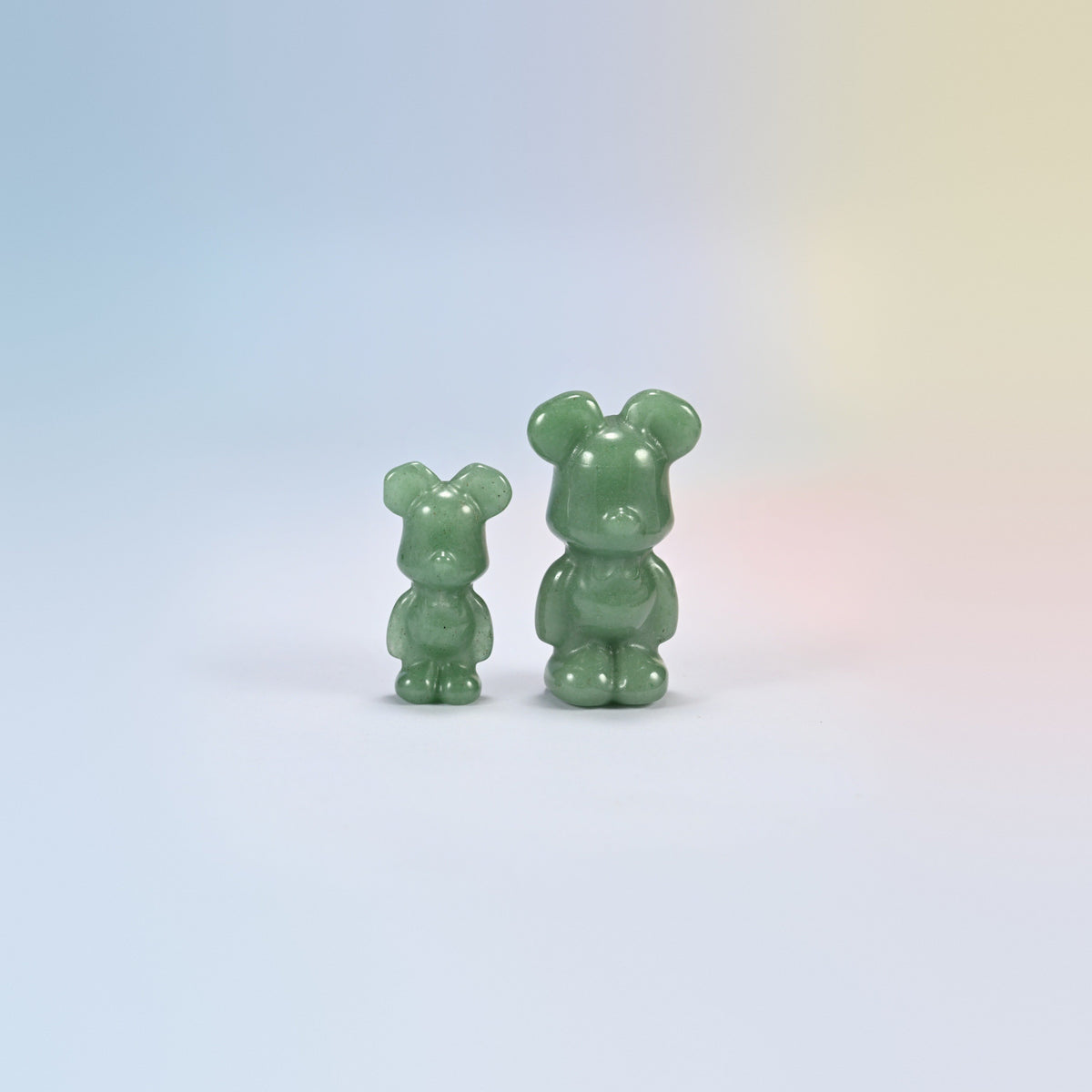 A 1.5 inch and a 2 inch green aventurine power bear crystal carving, soft green natural stone