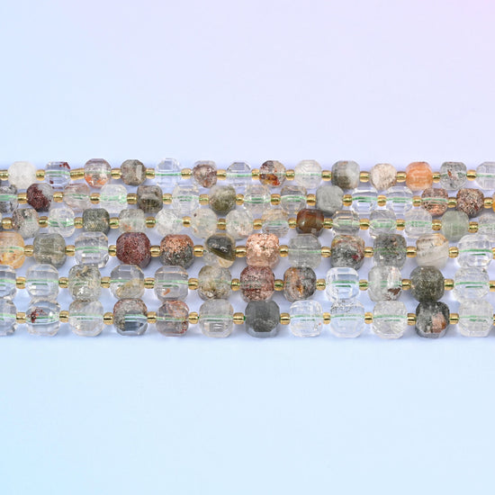 Green Phantom Quartz beads in clear to smoky quartz with mossy green phantom clouds