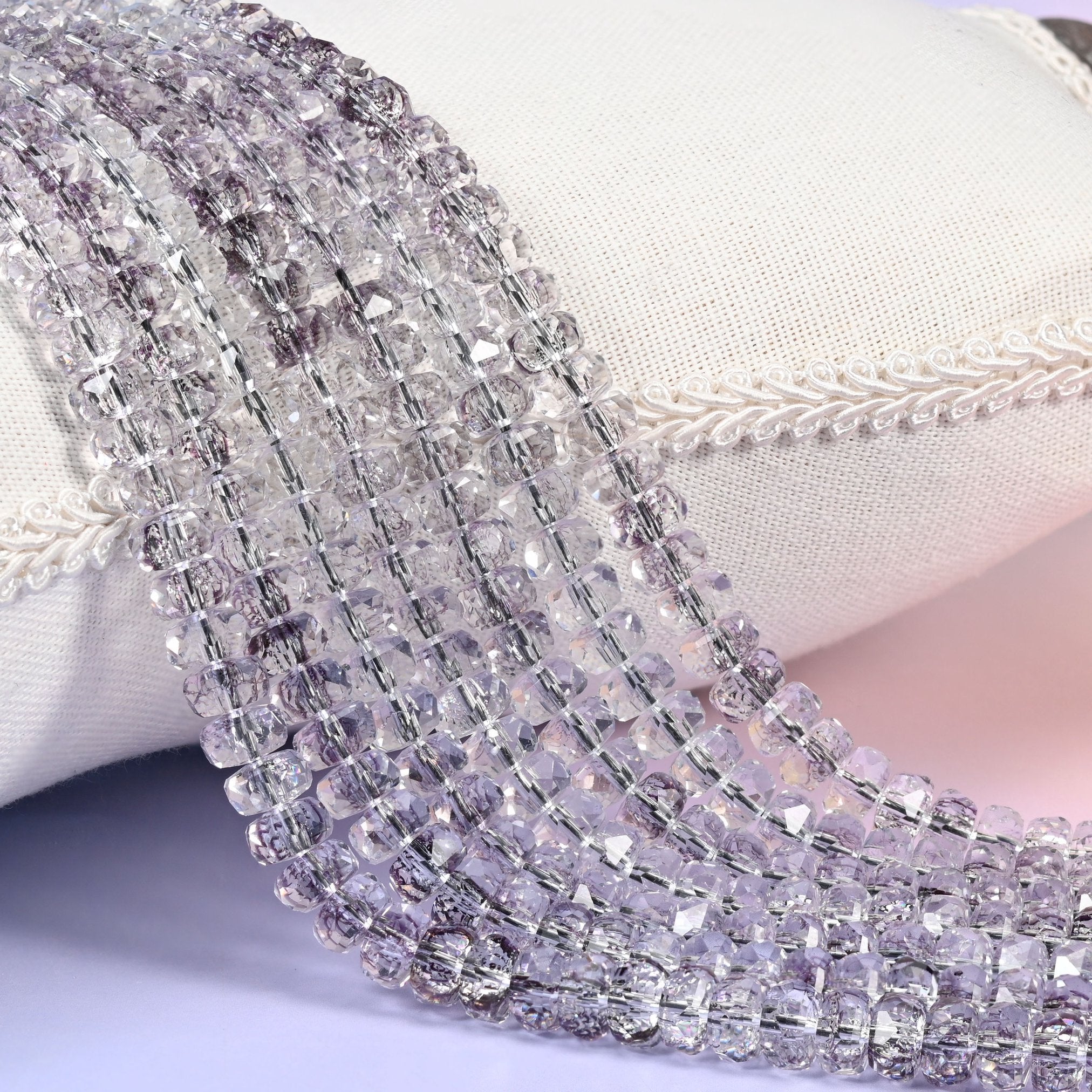 Transparent light purple faceted rondelle glass beads in the palest smoky lilac
