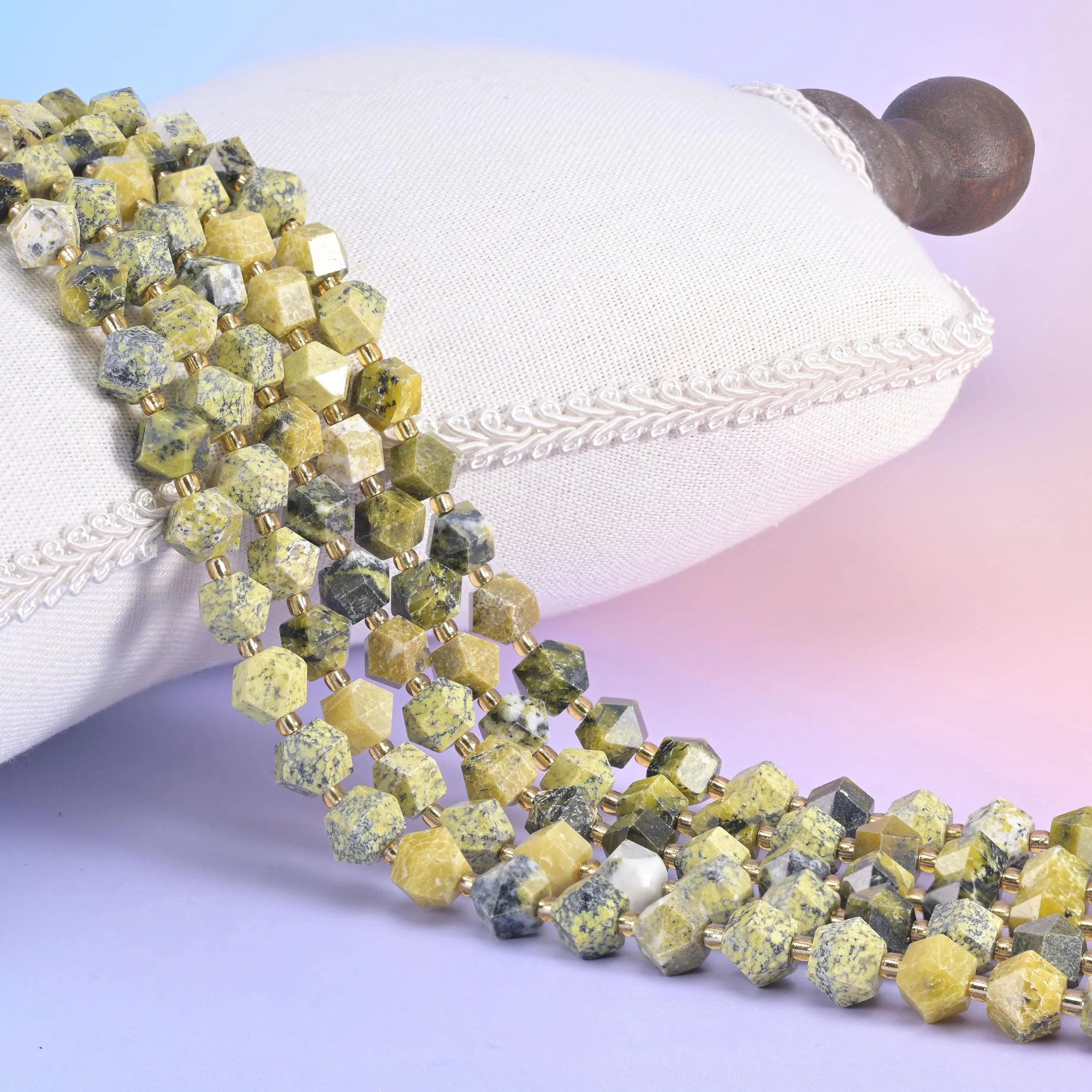 Yellow Howlite faceted diamond rhombus beads in soft chartreuse-to-butter yellow with grey-green veining